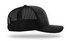 Right side profile of a solid black Richardson 112 trucker hat with a pre-curved visor and structured six-panel design.
